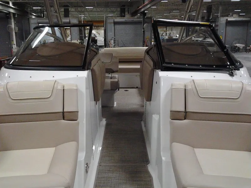 Slide: The Image of 2016 Formula 270 Bowrider interior with beige seating and dual windshields. - 17