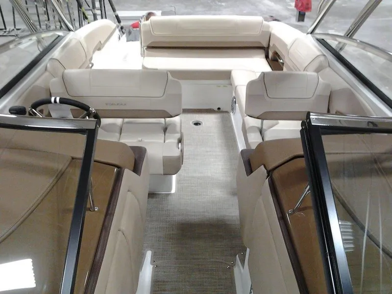 Slide: The Image of 2016 Formula 270 Bowrider interior with beige seating and steering wheel. - 18