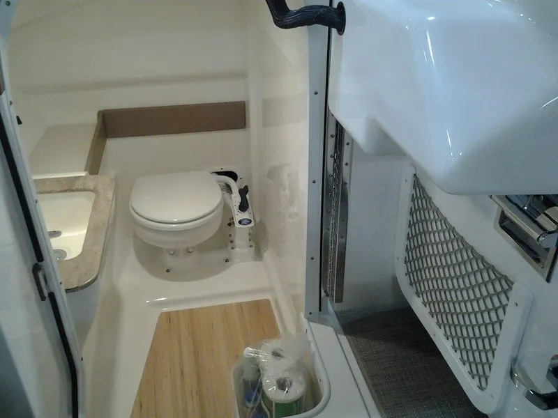 Slide: The Image of 2016 Formula 270 Bowrider boat interior with compact bathroom and toilet. - 20
