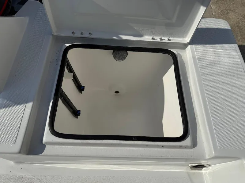 Slide: The Image of Open storage compartment on 2025 Shallow Sport 18 Sport boat. - 17