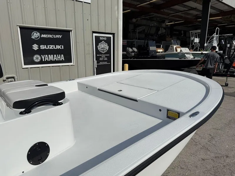 Slide: The Image of 2025 Shallow Sport 18 Sport boat at West Coast Marine dealership. - 6