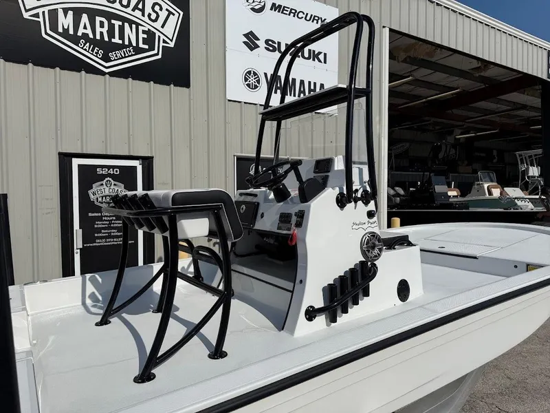 Slide: The Image of 2025 Shallow Sport 18 Sport boat at West Coast Marine dealership. - 9