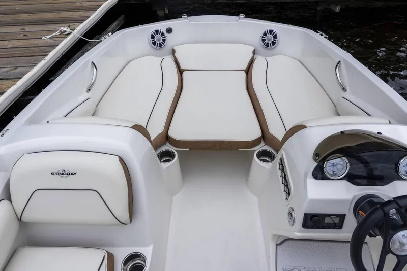 Slide: The Image of Manufacturer Provided Image: 2024 Stingray 182 SC boat interior with white and brown seating. - 9