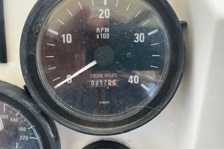 Slide: The Image of Close-up of a 2003 Mainship Pilot 34 tachometer showing 657 engine hours. - 10