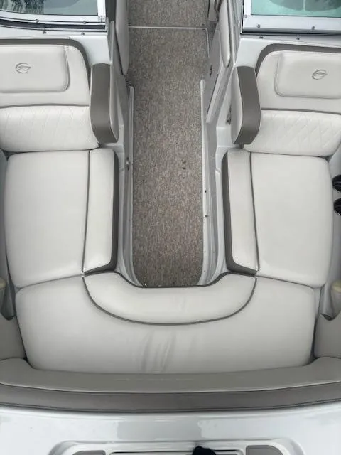 Slide: The Image of 2018 Crownline Eclipse E215 XS boat interior with white cushioned seating. - 21