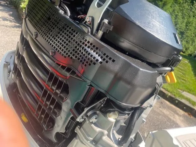 Slide: The Image of Close-up of a 2018 Crownline Eclipse E215 XS boat engine, showcasing intricate mechanical details. - 26