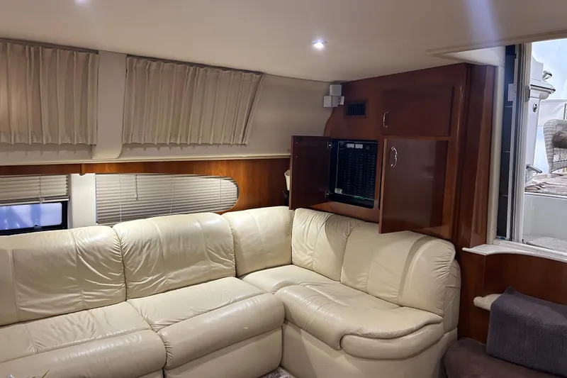 Slide: The Image of Luxurious interior of 2003 Carver 466 Motor Yacht with elegant dining area and floral centerpiece. - 18