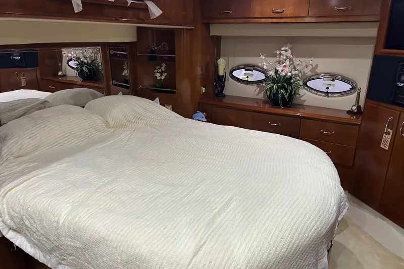 Slide: The Image of Luxurious bathroom in 2003 Carver 466 Motor Yacht with granite countertop and oval window. - 23