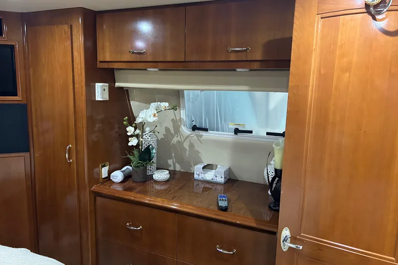 Slide: The Image of Kitchen area of 2003 Carver 466 Motor Yacht with wood cabinetry and appliances. - 25