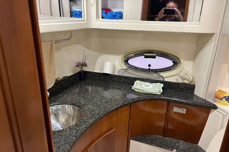 Slide: The Image of Bathroom interior of 2003 Carver 466 Motor Yacht with shower and porthole window. - 26