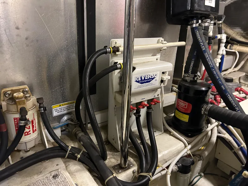 Slide: The Image of Control panel of a 2003 Carver 466 Motor Yacht generator with hour meter and emergency stop. - 39