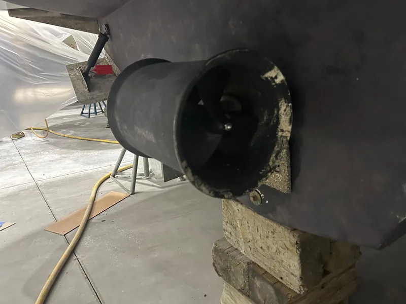 Slide: The Image of 2003 Carver 466 Motor Yacht kitchen with sleek black countertop and wooden cabinetry. - 43