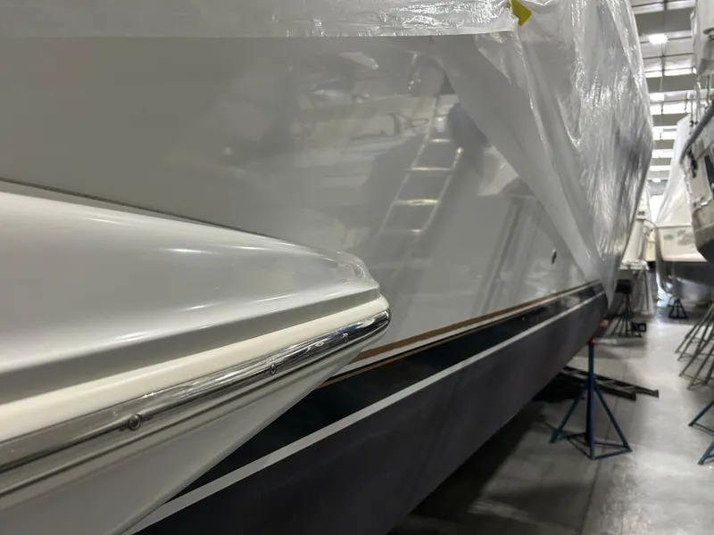 Slide: The Image of Luxurious bedroom interior of 2003 Carver 466 Motor Yacht with elegant bedding and wood finishes. - 45