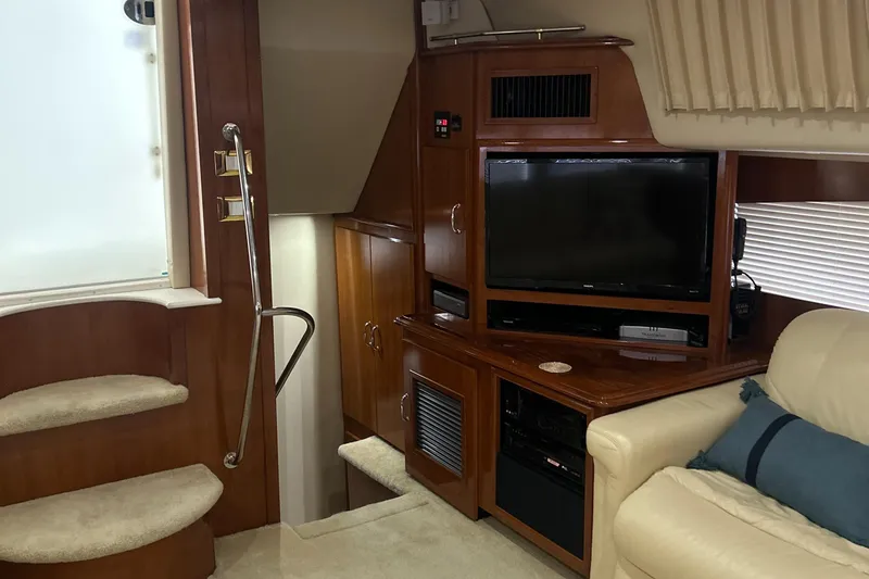 Slide: The Image of Luxurious bedroom interior of 2003 Carver 466 Motor Yacht with wood cabinetry and cozy bedding. - 52