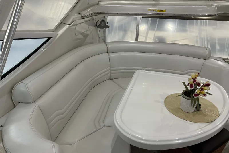 Slide: The Image of Interior view of 2003 Carver 466 Motor Yacht helm with marina backdrop. - 6