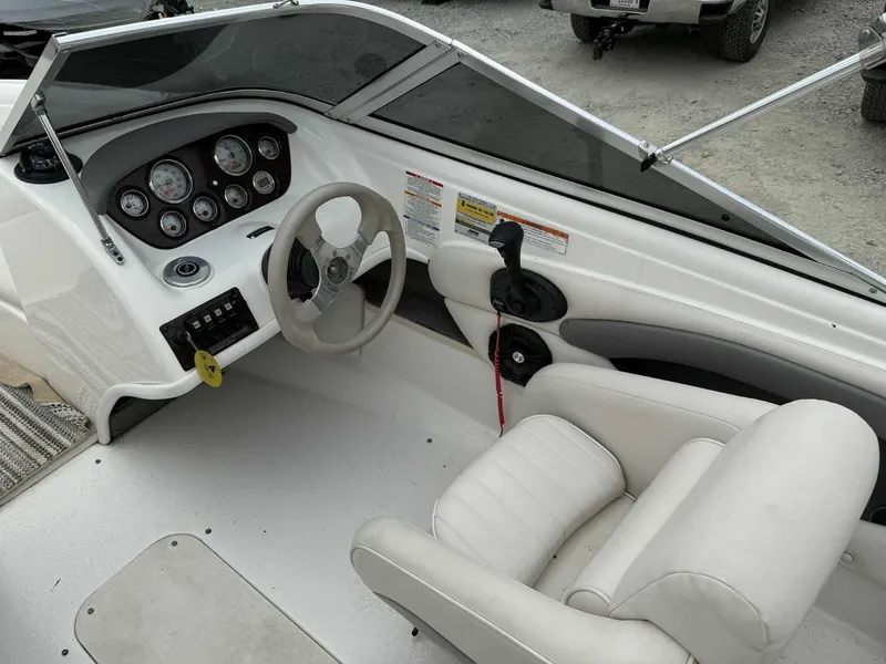 Slide: The Image of 2007 Chaparral 180 SSi boat interior with steering wheel and dashboard controls. - 11