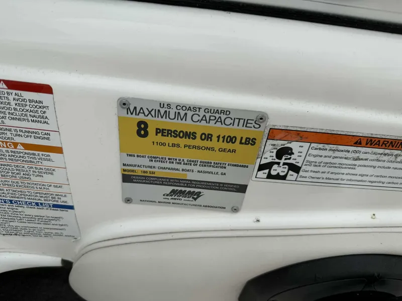 Slide: The Image of 2007 Chaparral 180 SSi capacity label, 8 persons or 1100 lbs, safety warnings visible. - 12