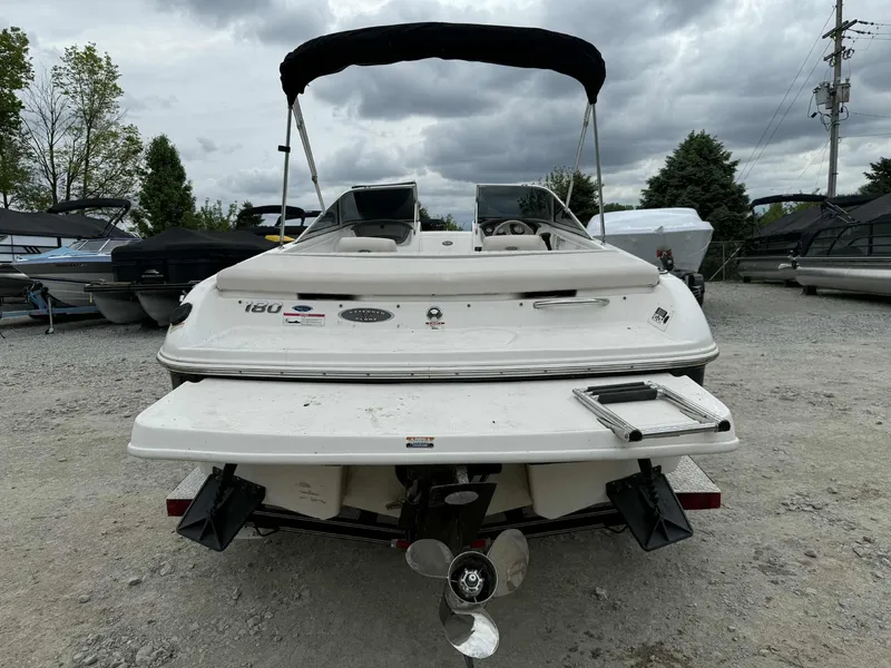 Slide: The Image of 2007 Chaparral 180 SSi boat, rear view, parked on gravel with overcast sky. - 4