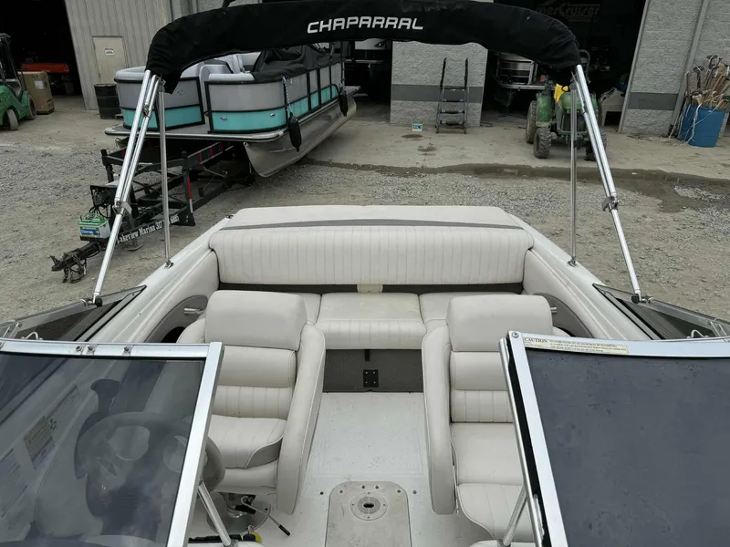 Slide: The Image of 2007 Chaparral 180 SSi boat interior with white seating and black canopy. - 7