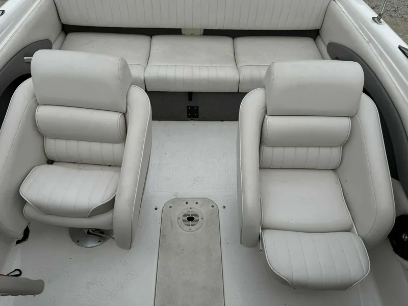 Slide: The Image of 2007 Chaparral 180 SSi boat interior with white cushioned seating. - 8