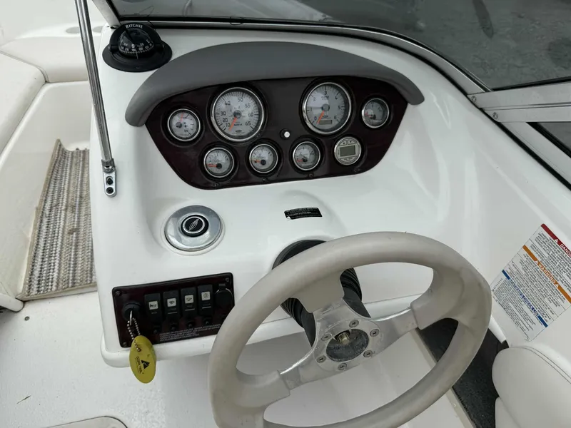 Slide: The Image of 2007 Chaparral 180 SSi boat dashboard with steering wheel and instrument panel. - 9