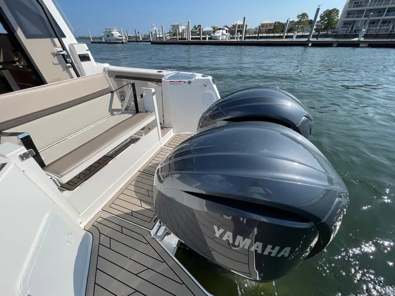 Slide: The Image of 2026 Cutwater C-288 Coupe with Yamaha outboard engines docked by the water. - 19