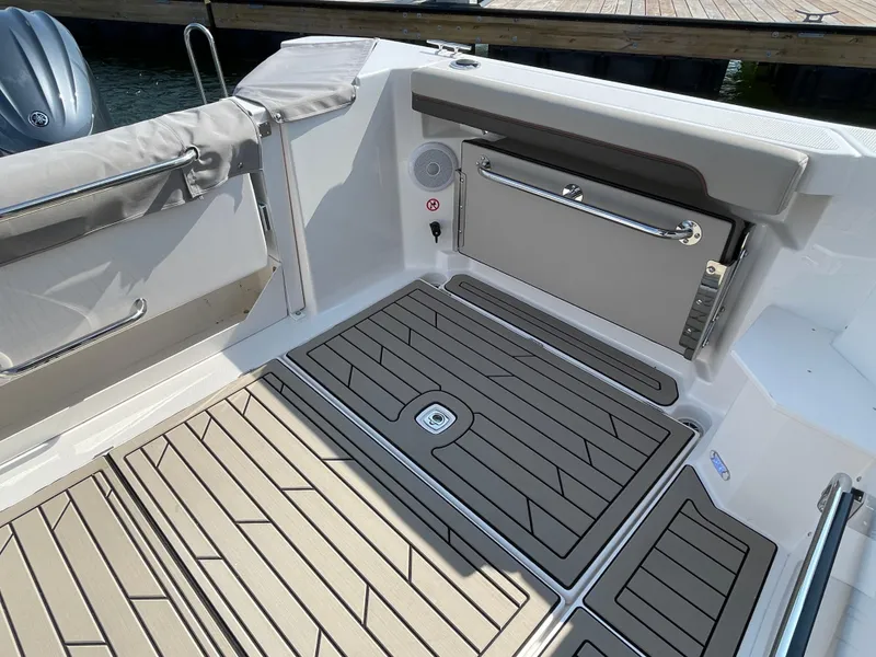 Slide: The Image of 2026 Cutwater C-288 Coupe boat interior with sleek flooring and seating. - 29
