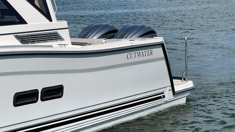 Slide: The Image of 2026 Cutwater C-288 Coupe boat on water, showcasing sleek design and modern features. - 3