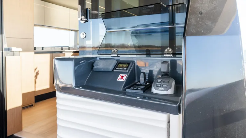 Slide: The Image of Control panel of 2025 Absolute 60 Fly yacht, featuring modern navigation equipment. - 10
