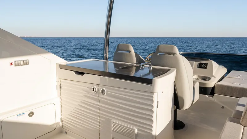 Slide: The Image of Luxury yacht Absolute 60 Fly 2025, featuring sleek outdoor seating and ocean view. - 19