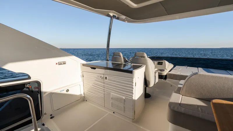 Slide: The Image of Luxurious 2025 Absolute 60 Fly yacht interior with ocean view and modern seating. - 20