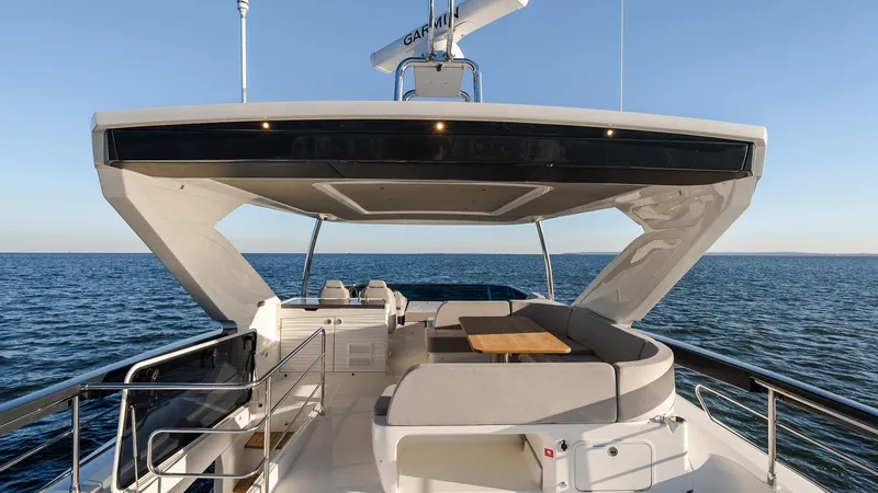 Slide: The Image of Luxurious 2025 Absolute 60 Fly yacht with spacious deck and ocean view. - 22