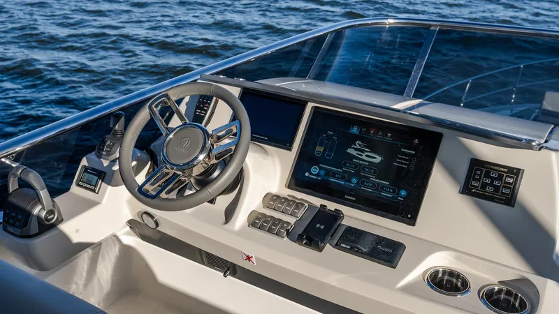 Slide: The Image of Helm of 2025 Absolute 60 Fly yacht with advanced navigation system and sleek design. - 27
