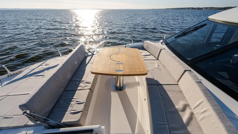 Slide: The Image of Luxurious 2025 Absolute 60 Fly yacht deck with sunlit ocean view. - 36