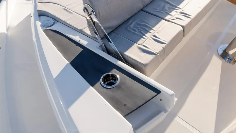 Slide: The Image of Luxury seating area on 2025 Absolute 60 Fly yacht with cup holder. - 38