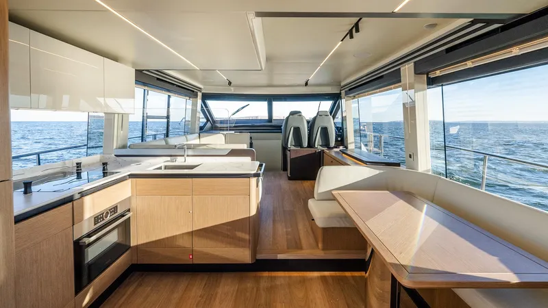 Slide: The Image of Luxurious interior of 2025 Absolute 60 Fly yacht with modern kitchen and ocean view. - 39