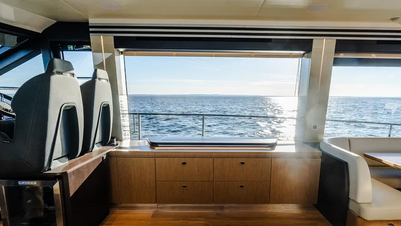 Slide: The Image of Interior view of 2025 Absolute 60 Fly yacht with ocean view through large windows. - 46
