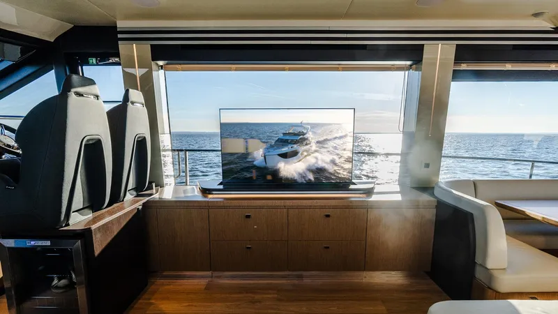 Slide: The Image of Interior of 2025 Absolute 60 Fly yacht with ocean view and TV display. - 47