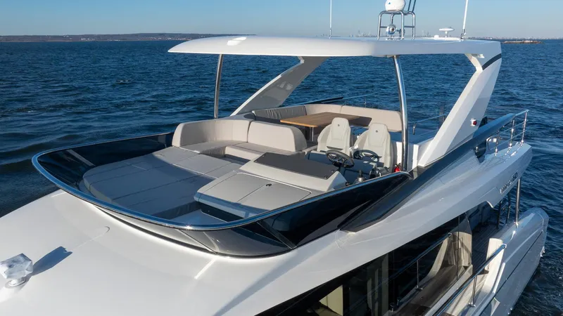 Slide: The Image of 2025 Absolute 60 Fly yacht with spacious flybridge on open water. - 6