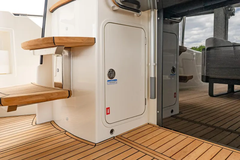 Slide: The Image of Luxurious teak deck and stairs on 2026 Absolute 60 Fly yacht. - 13