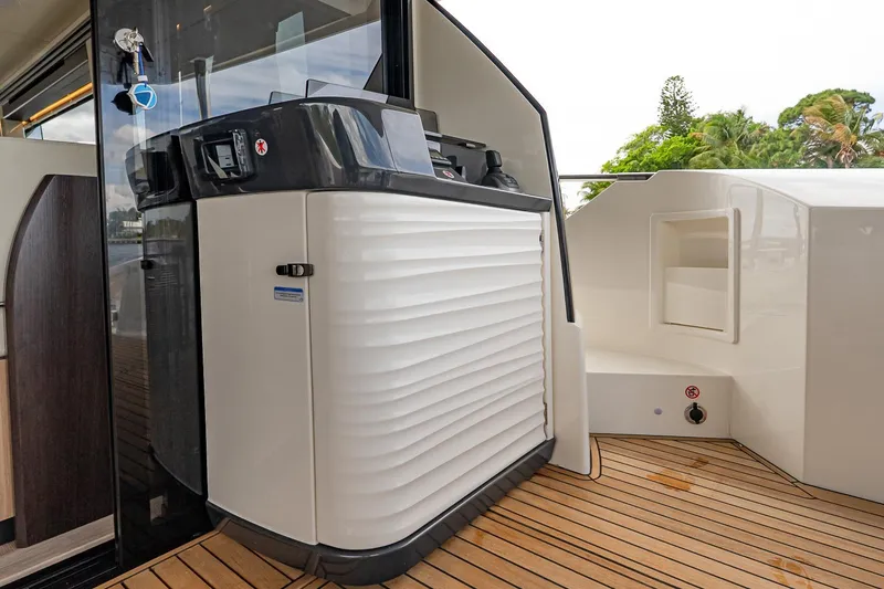 Slide: The Image of Modern Absolute 60 Fly yacht deck with sleek design and wood flooring, 2026 model. - 14
