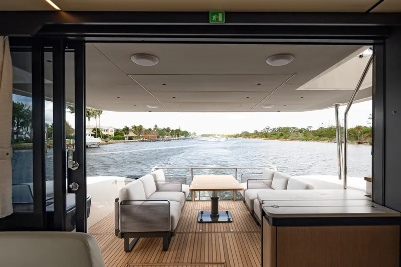 Slide: The Image of Luxurious 2026 Absolute 60 Fly yacht interior with elegant seating and scenic waterway view. - 15