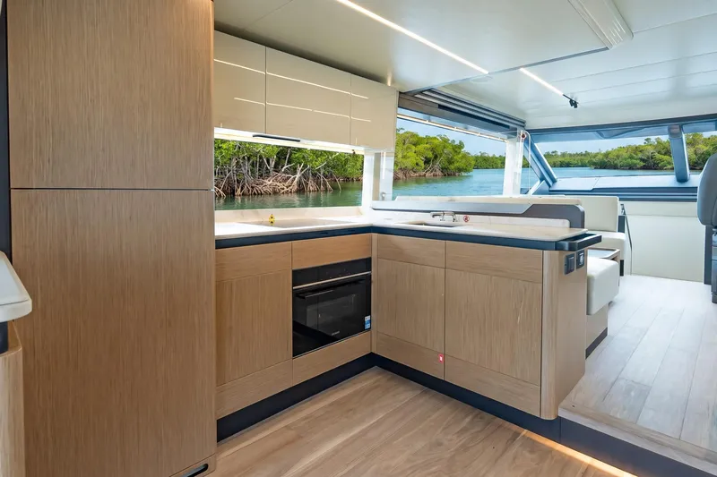 Slide: The Image of Modern kitchen interior on 2026 Absolute 60 Fly yacht with scenic water view. - 17