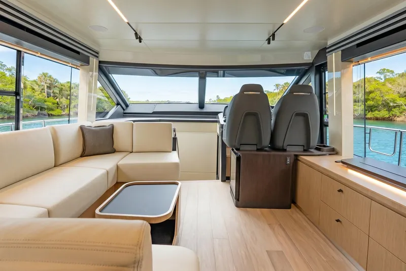 Slide: The Image of Luxurious interior of 2026 Absolute 60 Fly yacht with modern seating and panoramic windows. - 21