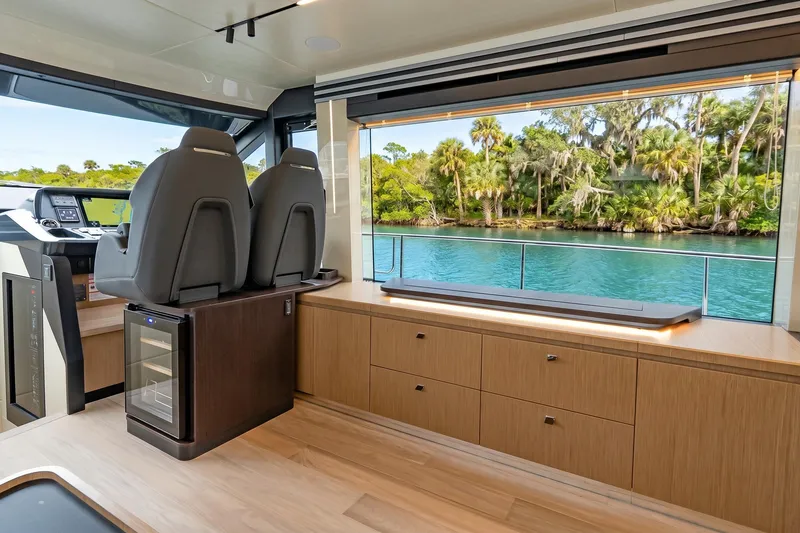 Slide: The Image of Luxurious interior of 2026 Absolute 60 Fly yacht with scenic water view. - 24