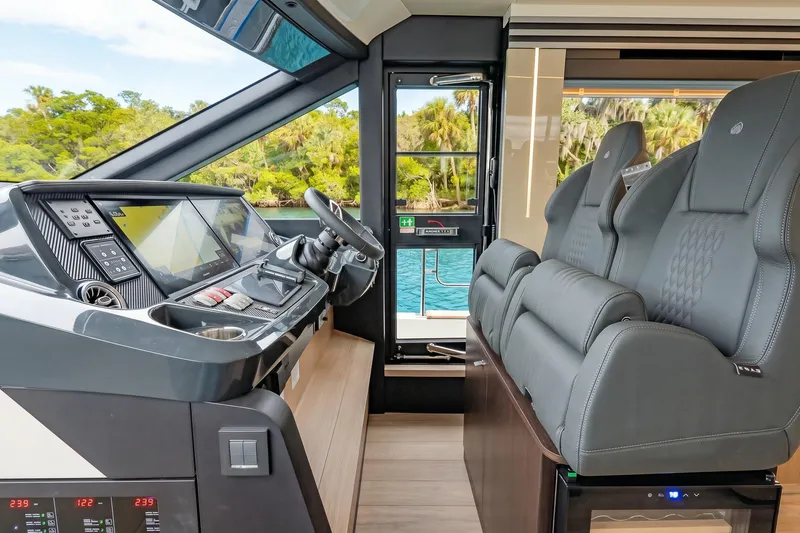 Slide: The Image of Luxurious helm of 2026 Absolute 60 Fly yacht with advanced navigation systems and plush seating. - 27