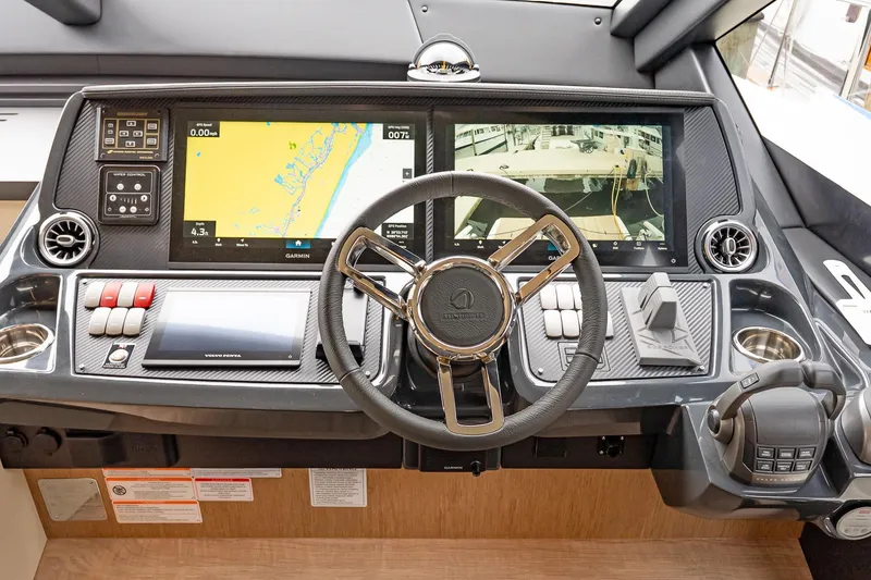 Slide: The Image of Helm of 2026 Absolute 60 Fly yacht with advanced navigation displays and controls. - 30