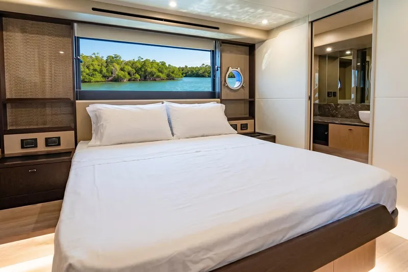 Slide: The Image of Luxurious bedroom interior of 2026 Absolute 60 Fly yacht with scenic window view. - 32