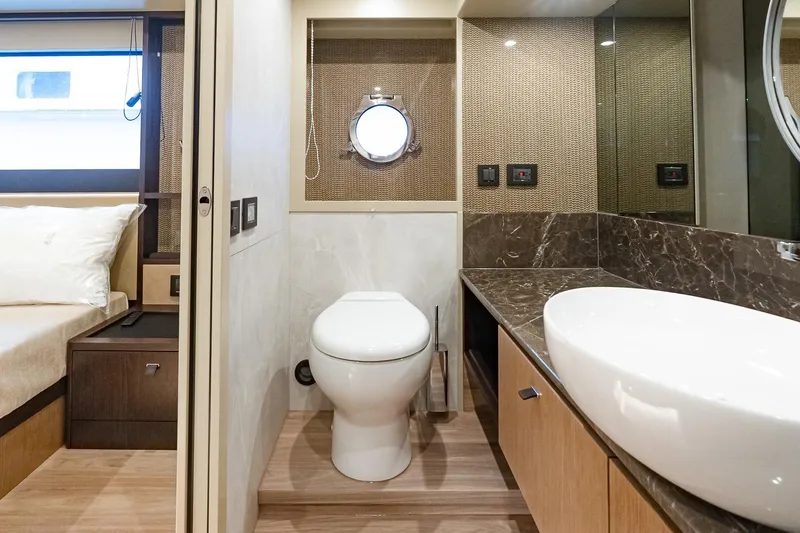Slide: The Image of Luxurious bathroom on 2026 Absolute 60 Fly yacht with modern fixtures and elegant design. - 37