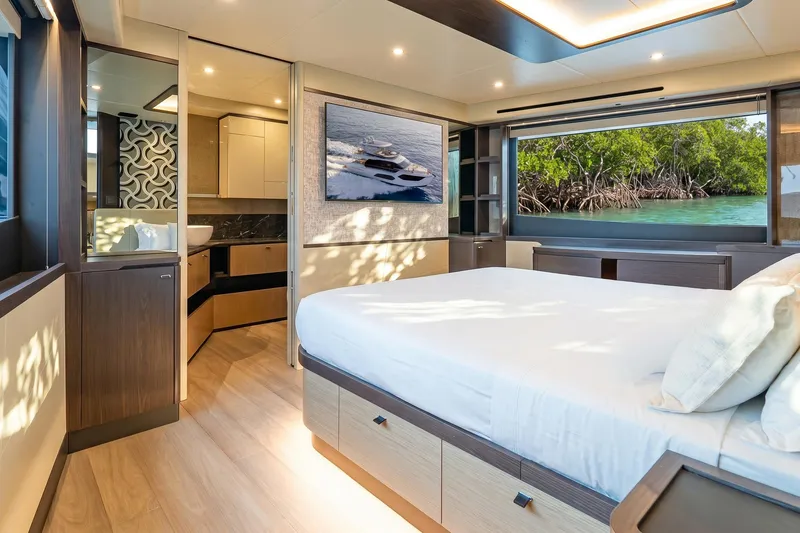 Slide: The Image of Luxurious interior of 2026 Absolute 60 Fly yacht with scenic window view. - 38